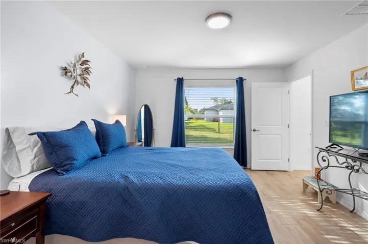 Bedroom featuring parquet flooring