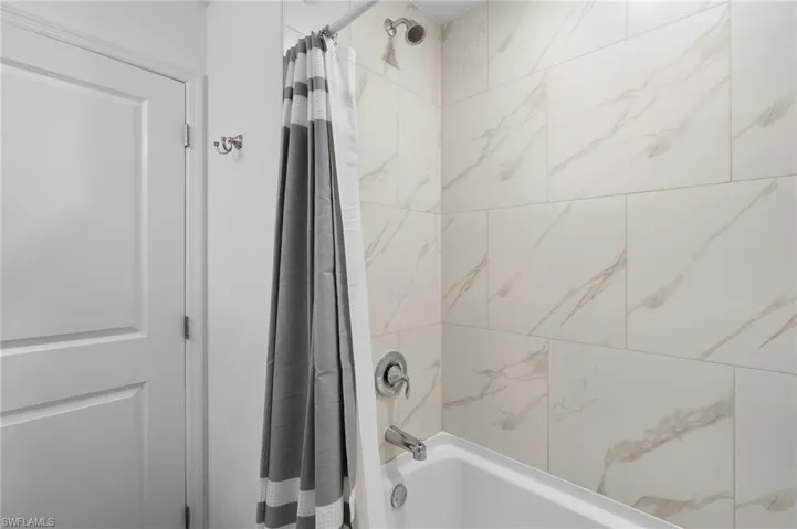 Full bathroom featuring shower / tub combo