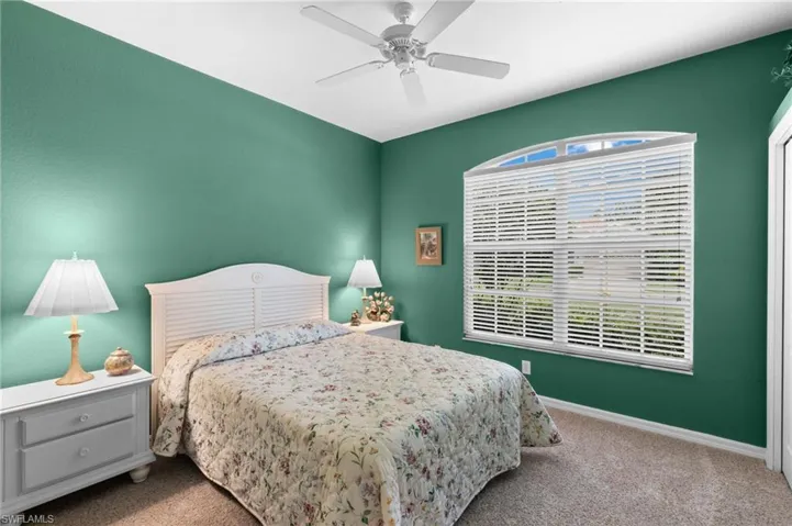 Bedroom with carpet and ceiling fan