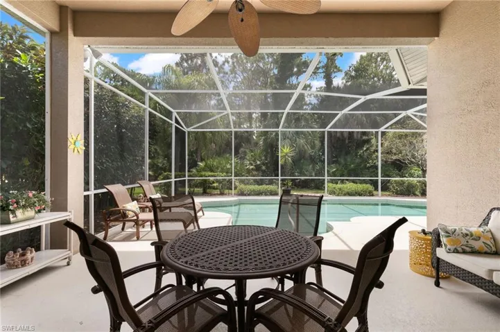 Sunroom with a healthy amount of sunlight and ceiling fan