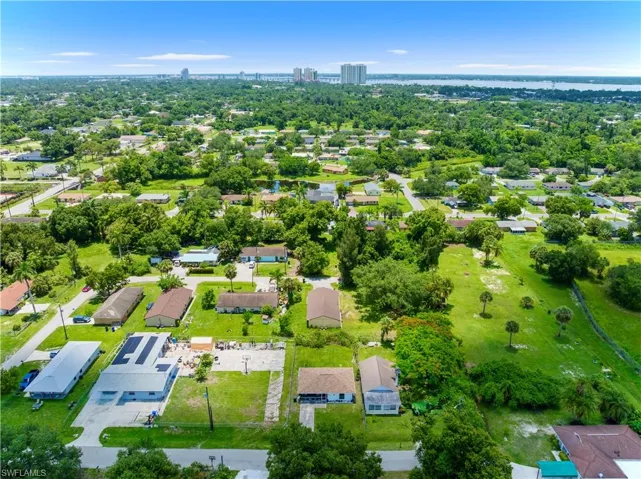 Aerial perspective of suburban area with a tree filled landscape