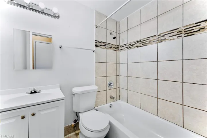 Bathroom with vanity and shower / bathtub combination
