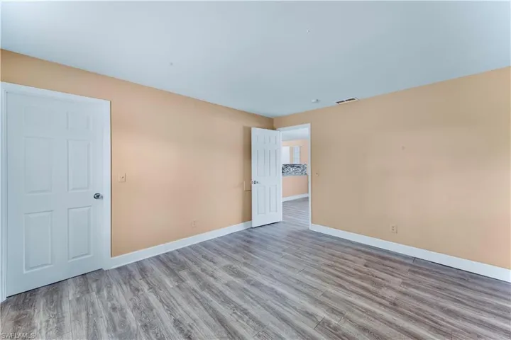 Unfurnished room featuring wood finished floors