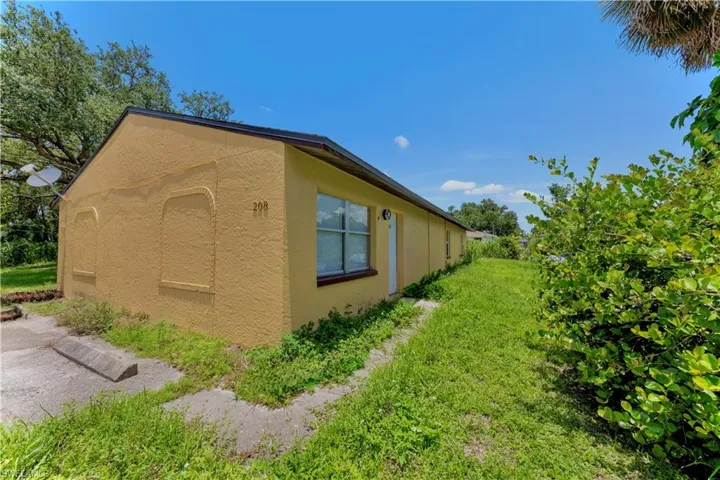 View of side of home with stucco siding