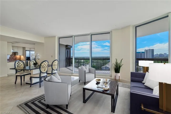 Living room featuring floor-to-ceiling sliders and a wealth of natural light. - Virtually Staged