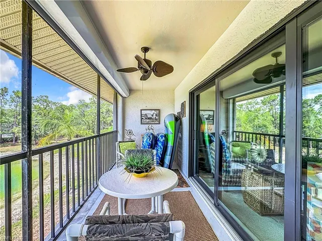 Sunroom / solarium featuring ceiling fan