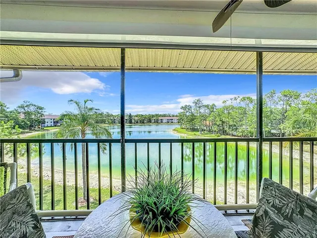 Sunroom / solarium with a water view