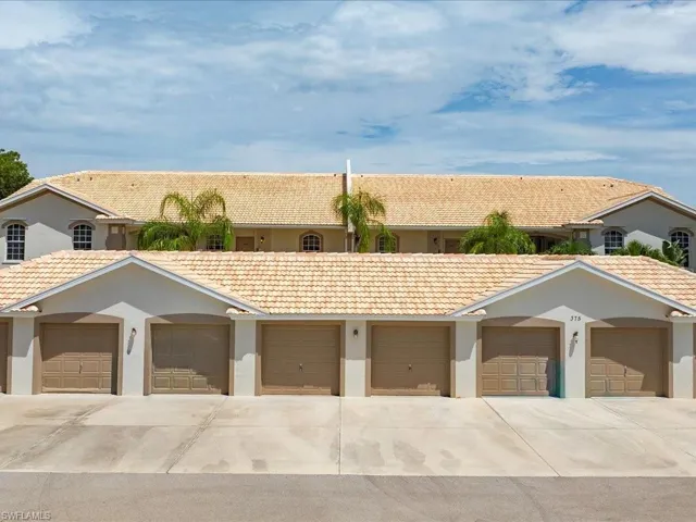 View of property with community garages