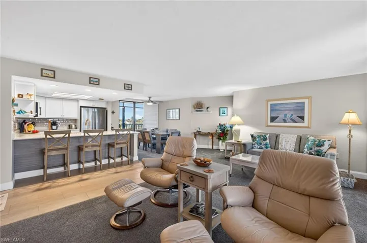 Living room with baseboards and ceiling fan