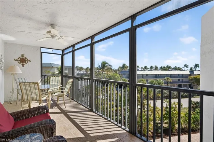 Sunroom / solarium featuring a view of gulf