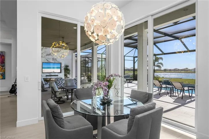 Double corner impact sliders allow for unobstructed views of the outdoor living area and lake beyond.