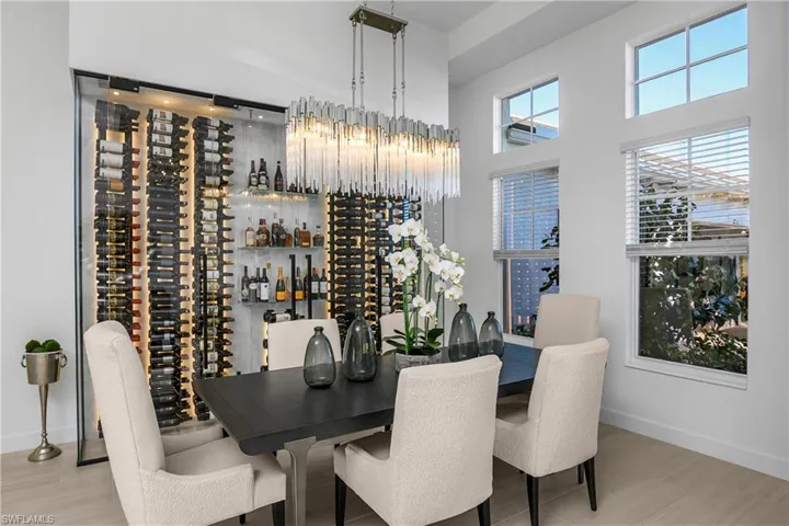 $80,000 Custom climate-controlled Wine Wall with glass doors and accent lighting holds up to 500 bottles of your favorite wines.