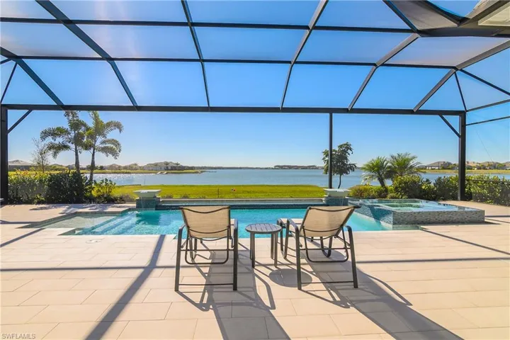 Gorgeous Custom pool and spa has it ALL: glass tile, sun shelf, spillover features, waterfall bowls, automatic water filling system, salt water chlorinator, and the best view in the community.