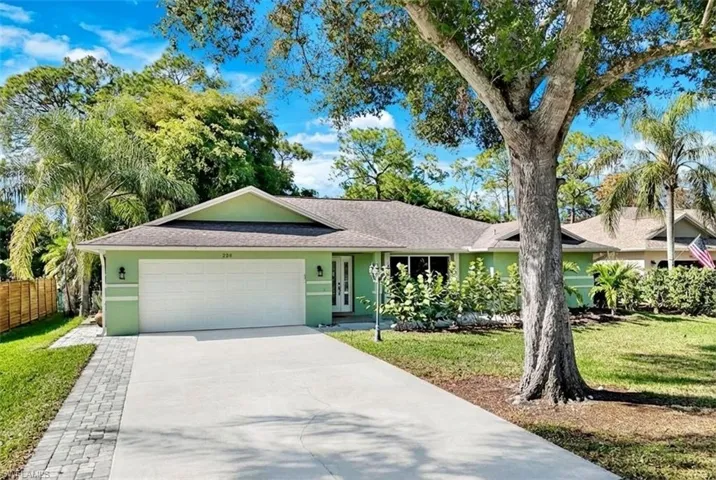 Single story home with concrete driveway, stucco siding, an attached garage, and a shingled roof