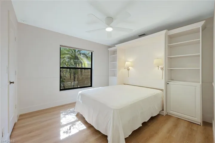 Bedroom #2 featuring light wood-type flooring and a ceiling fan