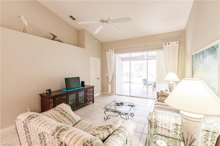 Spacious living room with tile floors.