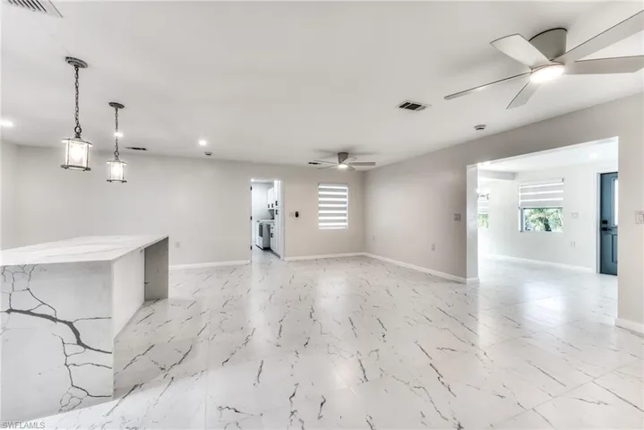 Spare room with ceiling fan and washer and clothes dryer