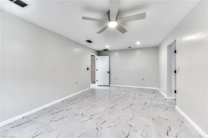 Spare room with ceiling fan
