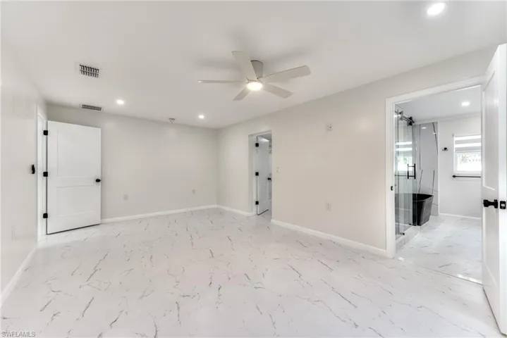 Unfurnished room featuring ceiling fan