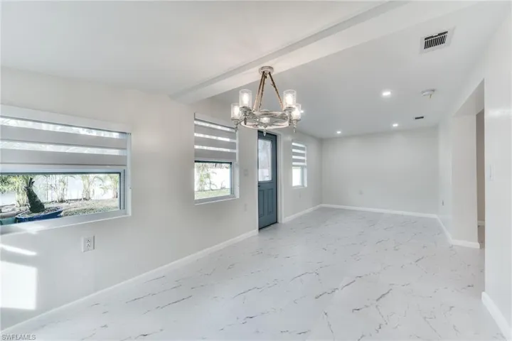 Entryway with an inviting chandelier