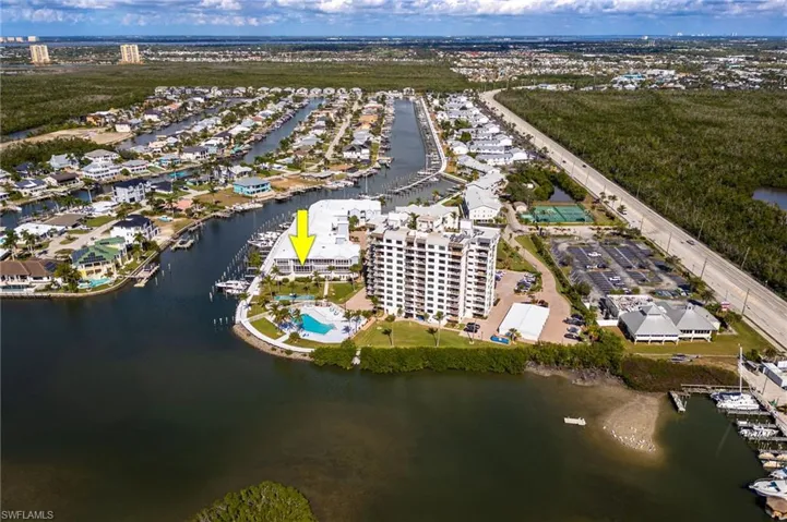 Aerial overview of property's location featuring a nearby body of water