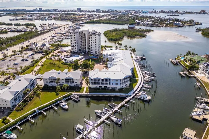 Drone / aerial view of a marina and a nearby body of water
