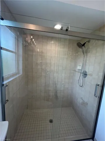 Bathroom featuring a shower stall