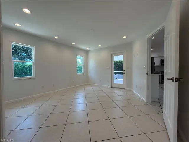 Spare room featuring recessed lighting and light tile patterned flooring
