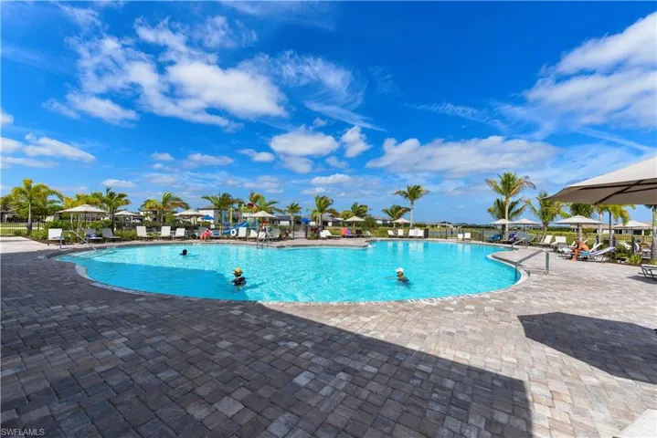 Community pool featuring a patio