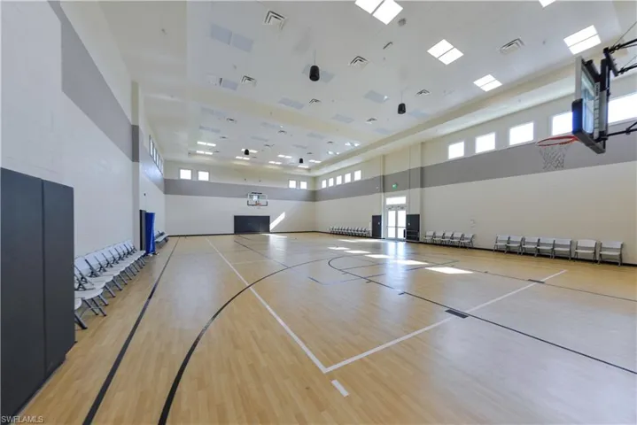 View of basketball court with community basketball court and healthy amount of natural light