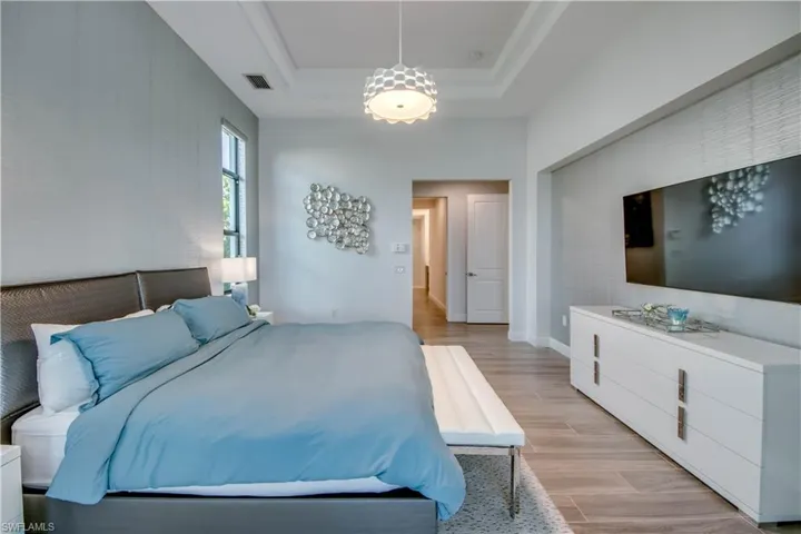 Walk in closet featuring wood finish floors