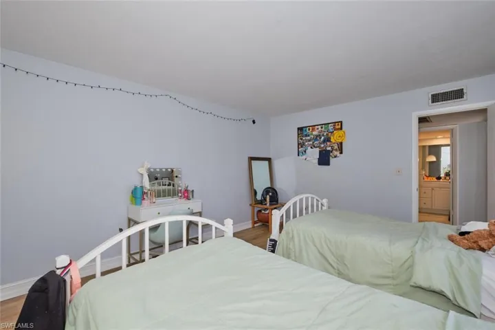 Bedroom featuring wood-type flooring