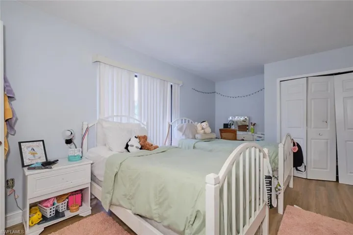Bedroom featuring a closet and hardwood / wood-style flooring
