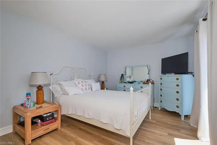 Bedroom with light hardwood / wood-style floors