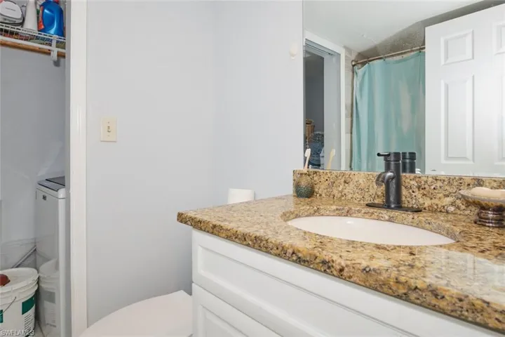 Bathroom with vanity and toilet