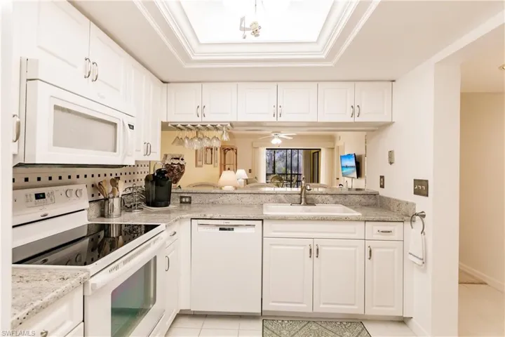 Kitchen with updated counter tops, appliances, sink and faucet