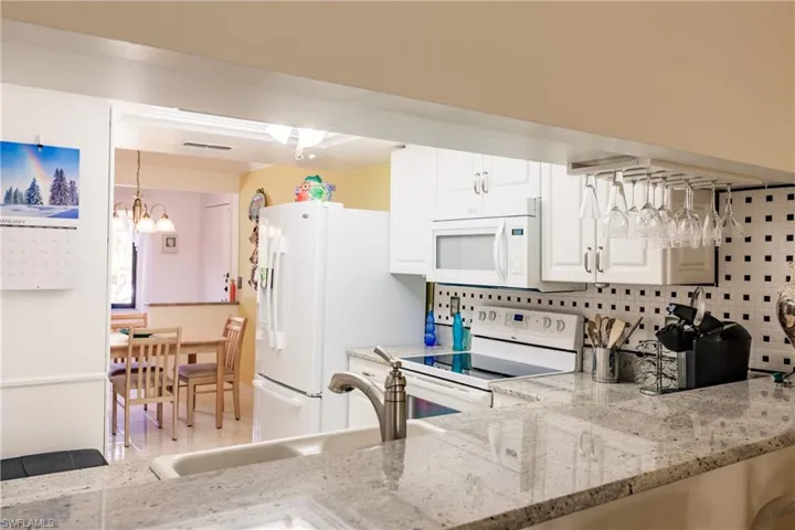 Kitchen featuring Bosch Dishwasher, whirlpool double door refrigerator and newer appliances