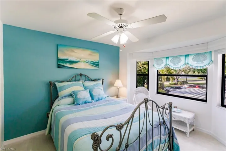 2nd bedroom with bay, window, soft blinds and wood valance