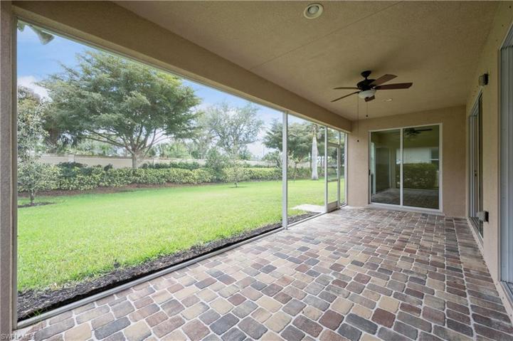 Screened lanai with view of yard