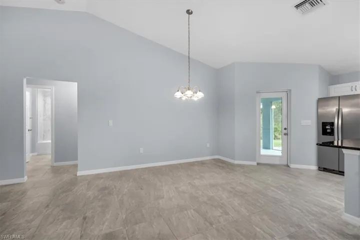 Vaulted ceilings, full glass door to lanai.