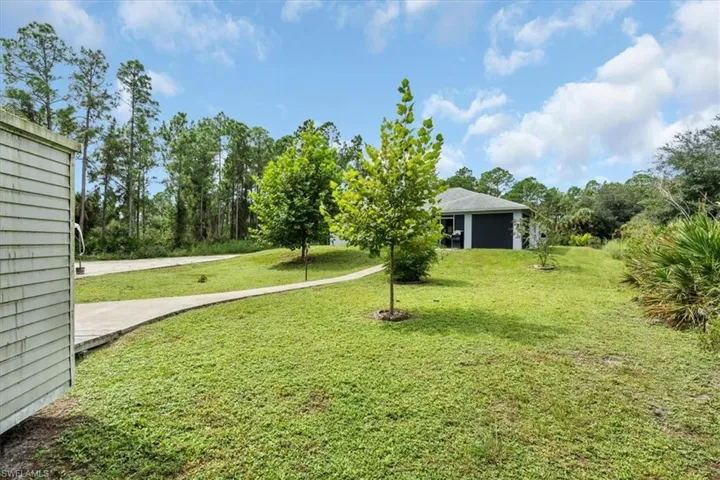 Sidewalk to rear of home