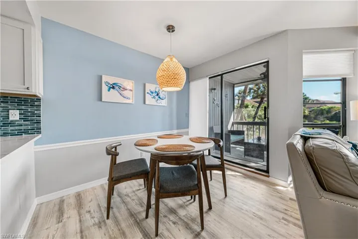 Dining Area with Sliders to the Screened Balcony.