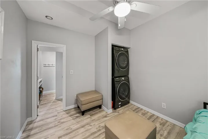Bedroom 4 or other with stacked washer and dryer and access to the attached garage.