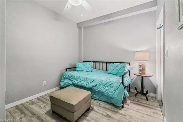 Being Used as Bedroom 4 or other featuring ceiling fan and full size washer and dryer and garage access.