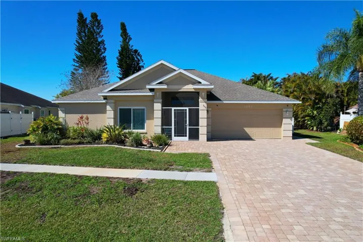 Single story home featuring stucco siding, decorative driveway, an attached garage, and a shingled roof