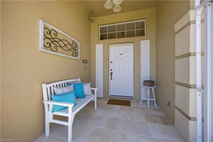 Property entrance with stucco siding