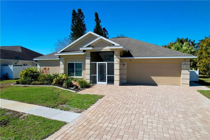 Ranch-style house featuring a front lawn, stucco siding, a garage, decorative driveway, and roof with shingles