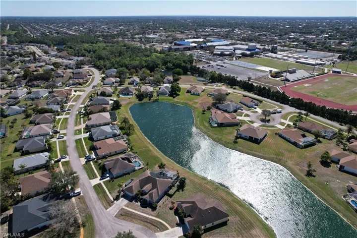 Aerial view of property's location featuring nearby suburban area