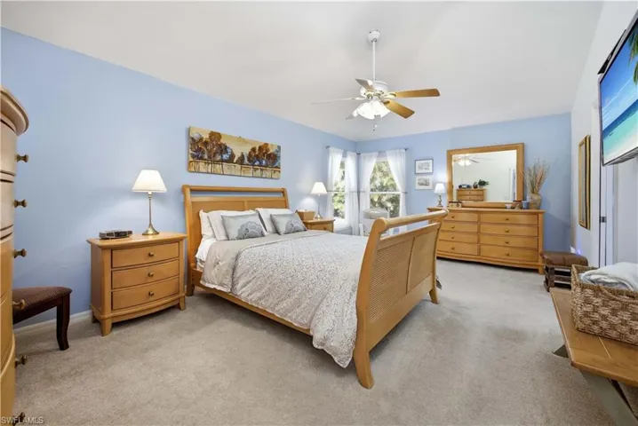 Bedroom with carpet and ceiling fan