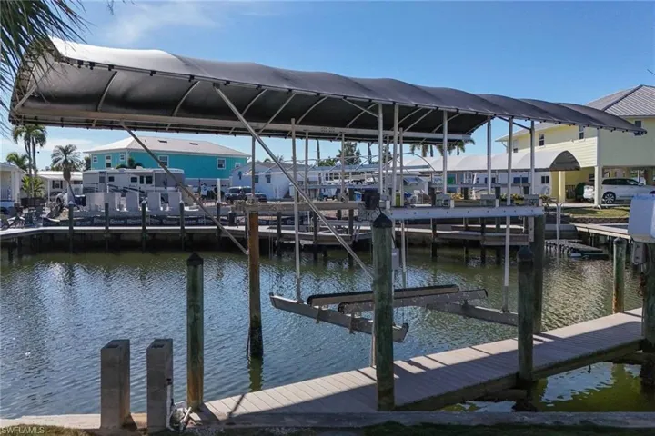 Dock featuring a water view and boat lift
